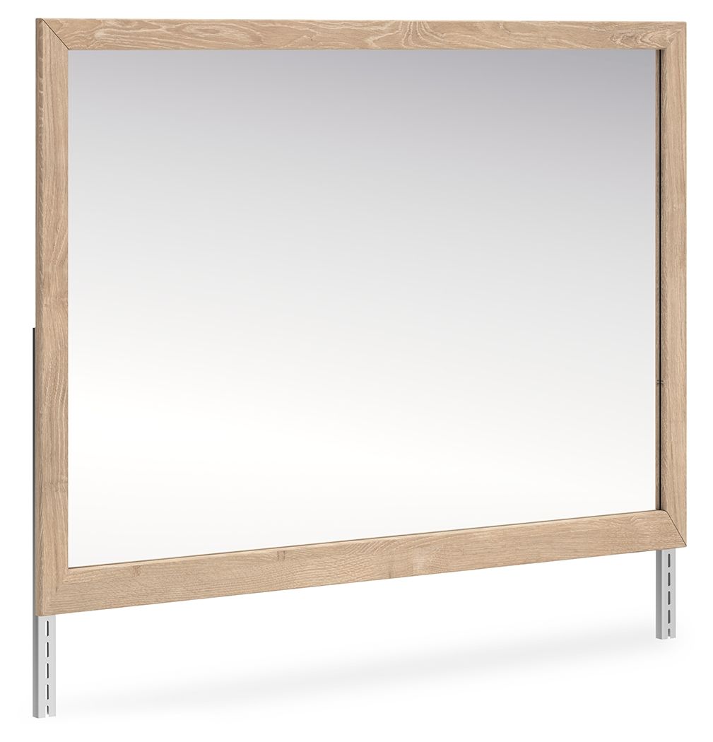 Tan wood bedroom mirror with rectangular frame and clear reflective glass