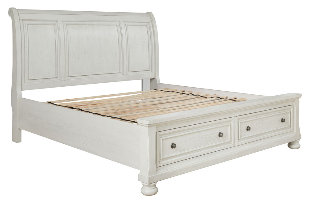 White sleigh bed frame with slatted mattress base and storage drawers