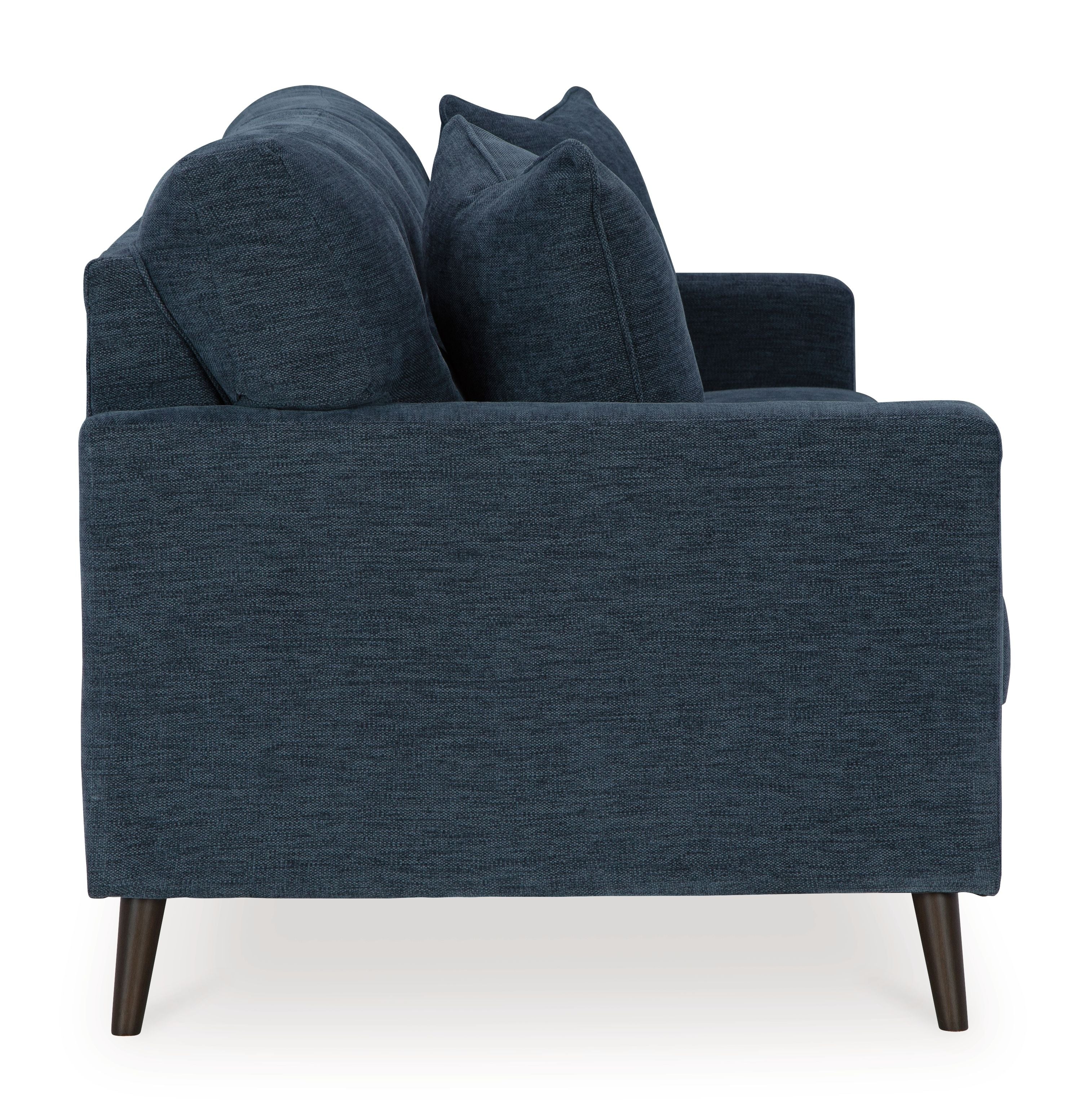 Navy blue sofa with three seat cushions and four back pillows