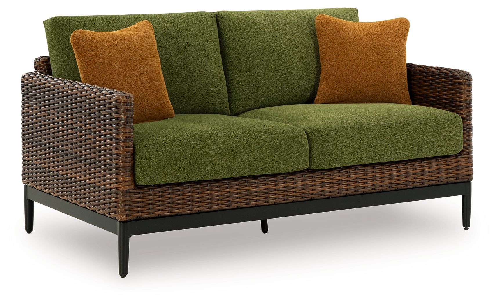 Wicker sofa with green seat cushions and brown throw pillows, black legs