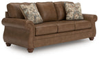 Chasemore sofa in dark brown with two patterned pillows and roll arms