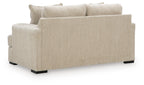 Beige loveseat with squared arms, two seat cushions, and matching solid throw pillows