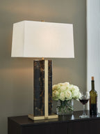 Black marble table lamp with gold frame and white fabric shade