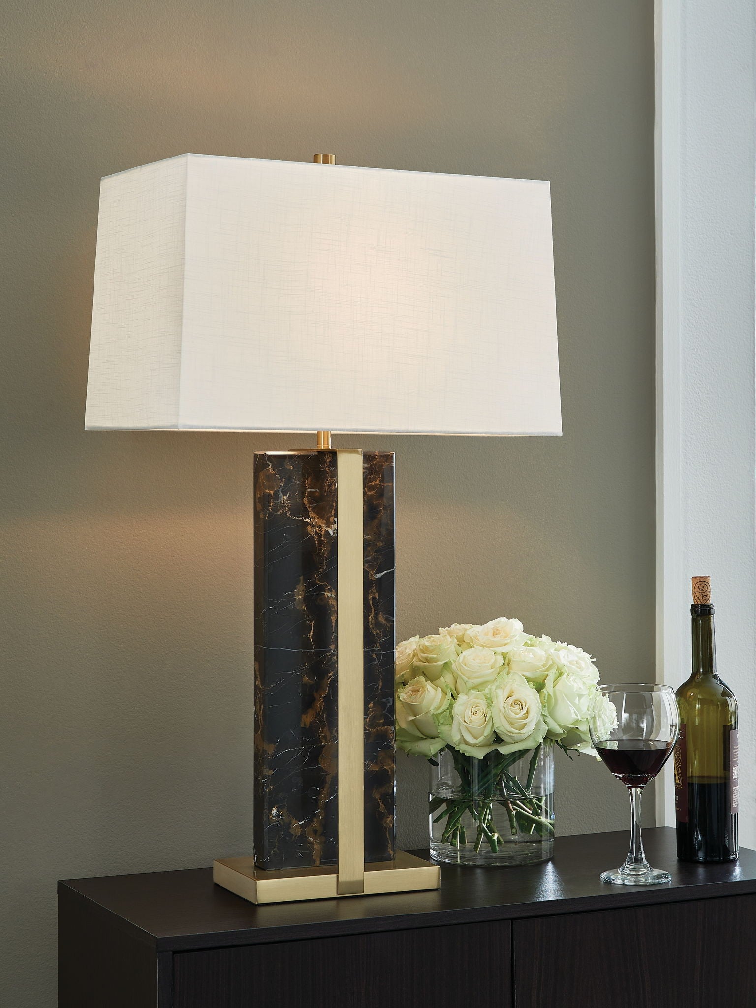 Black marble table lamp with gold frame and white fabric shade