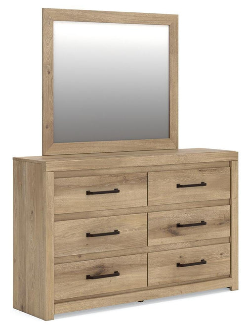 Light brown wooden dresser with mirror and six drawers with black bar pulls