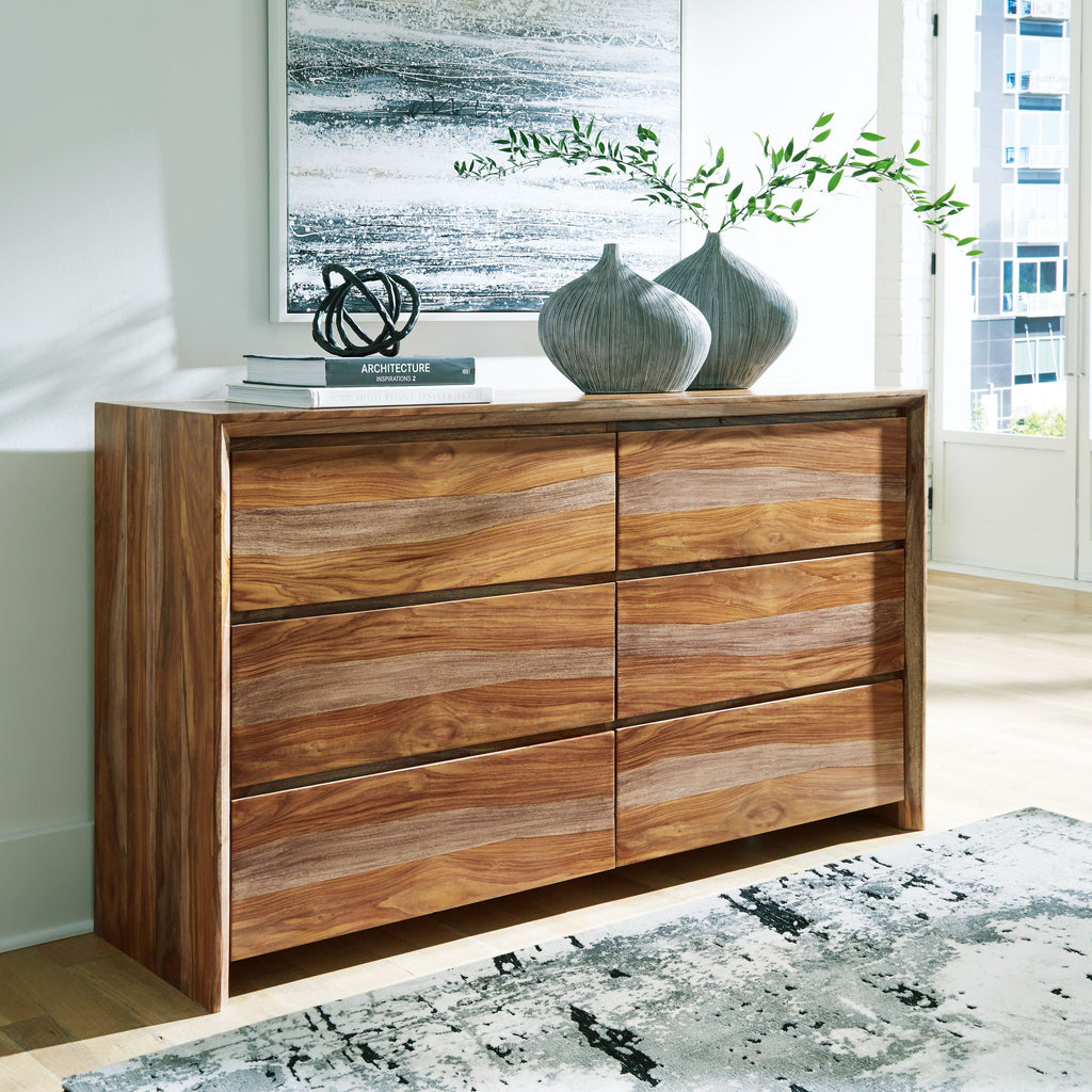 Brown wooden dresser with six drawer fronts in two vertical columns