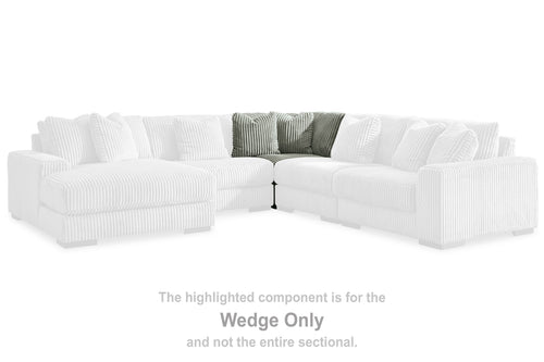 Light gray wedge sofa section with arrow marker on sectional layout, ribbed upholstery