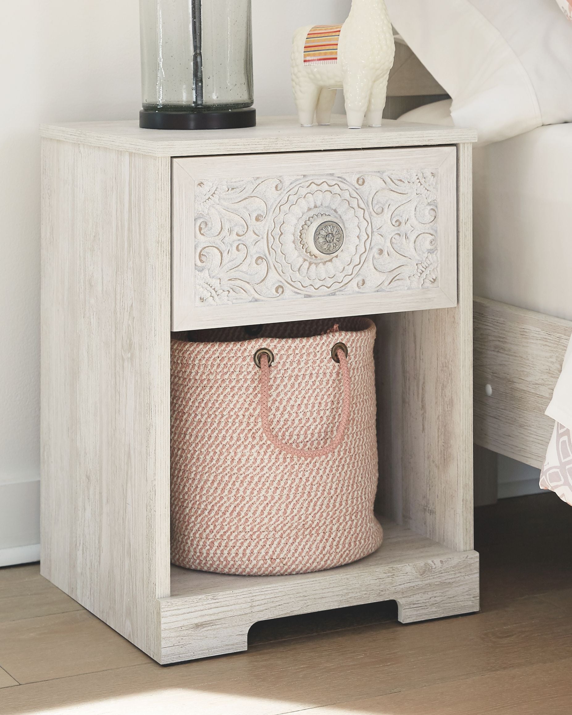 Whitewash night stand with open shelf and decorative carved one-drawer front