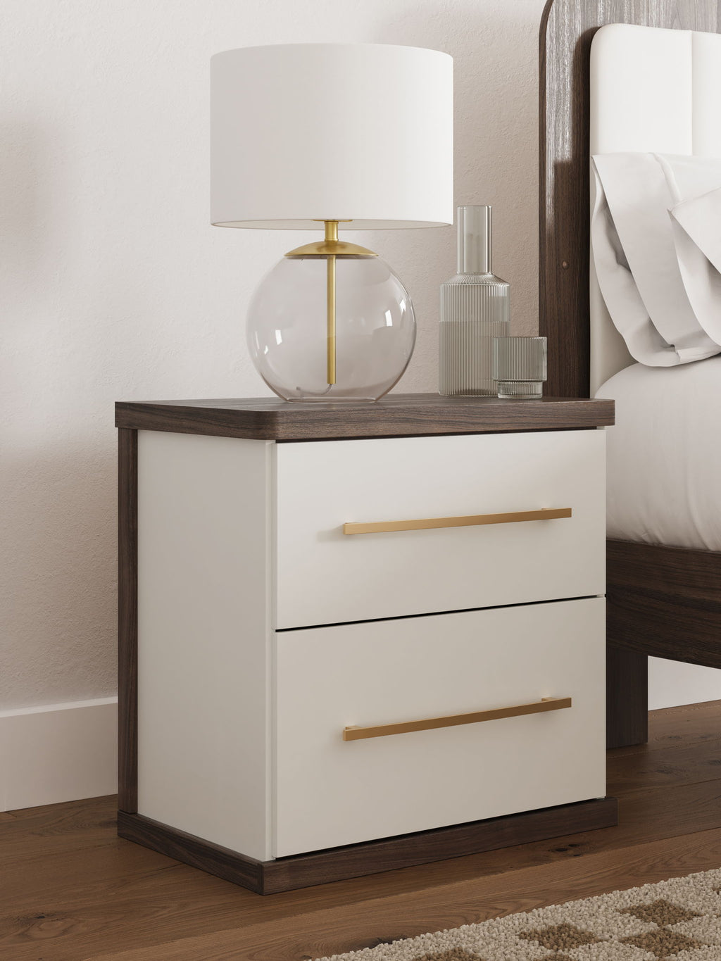 Kendanport two-drawer night stand in white with brown top and two gold-tone bar pulls