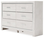 White dresser with mirror, side view showing six drawers and silver pull hardware