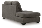 Graphite corner chaise with thick seat, tall backrest, rolled arm, and dark legs
