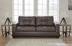 Dark gray sofa with tufted back and two seat cushions, shown with armrests