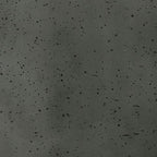 Textured dark speckled ceramic surface close-up with glossy glaze