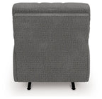 Gray upholstered recliner back view with rounded top and black legs