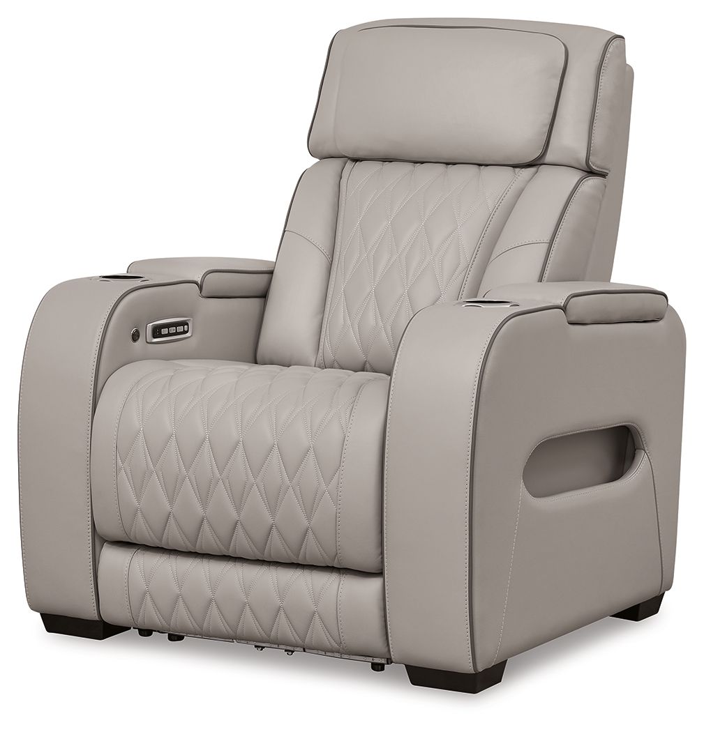 Gray power recliner with padded adjustable headrest and diamond-quilted seat back