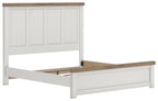 White panel bed frame with vertical paneled headboard and wood-tone rail accents.