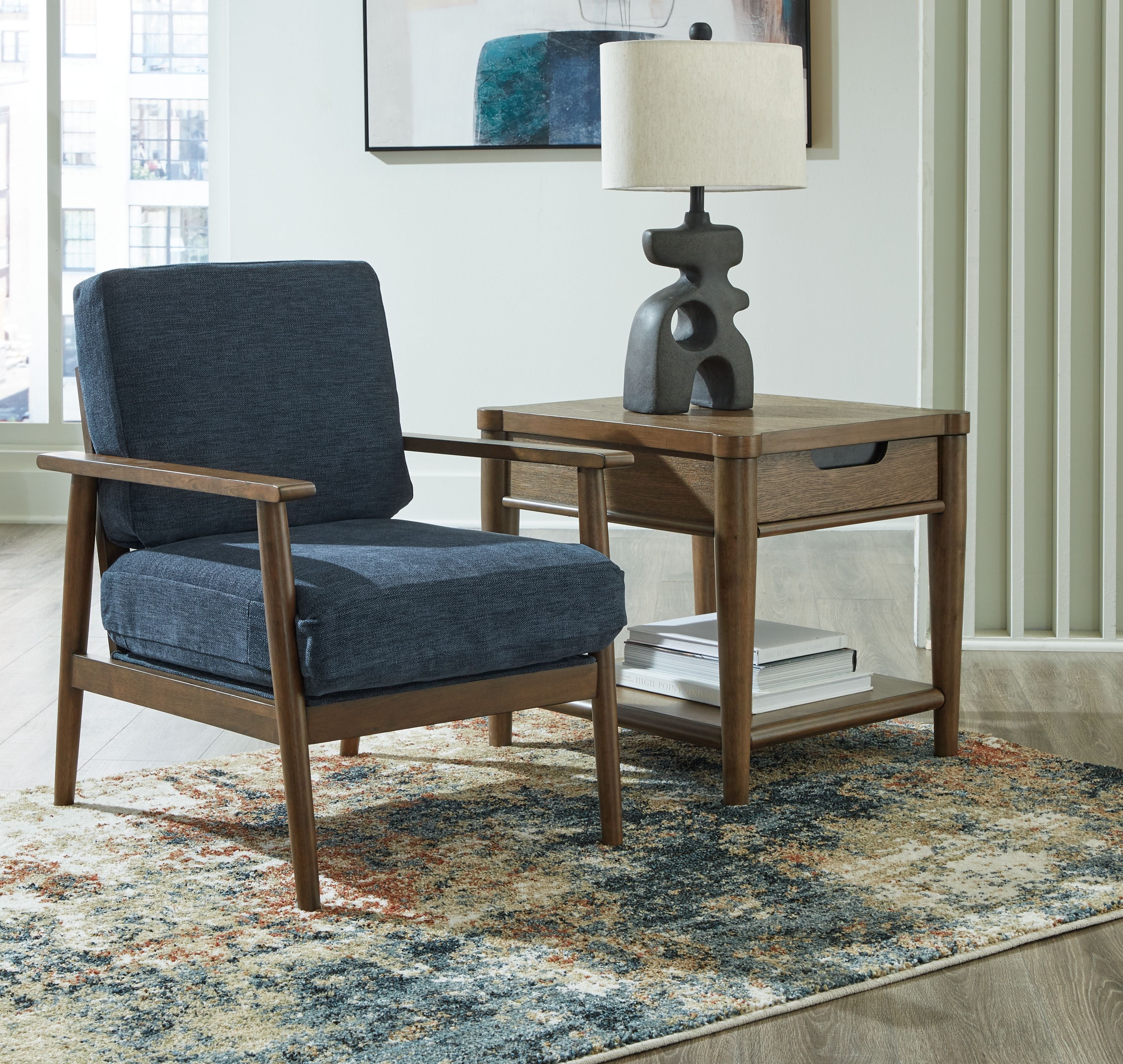 Blue accent chair with upholstered seat and back, dark wood arms and legs