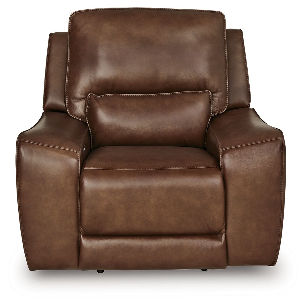 Caramel power recliner chair with wide padded backrest and recliner base.