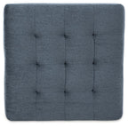 Blue upholstered ottoman top with stitched, square tufted pattern