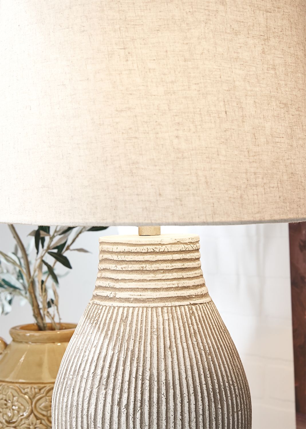 Layal paper table lamp close-up of beige shade and ribbed base neck
