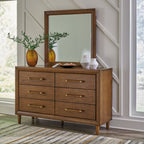 Upholstered bedroom dresser with mirror, dark brown wood drawers and brass pulls