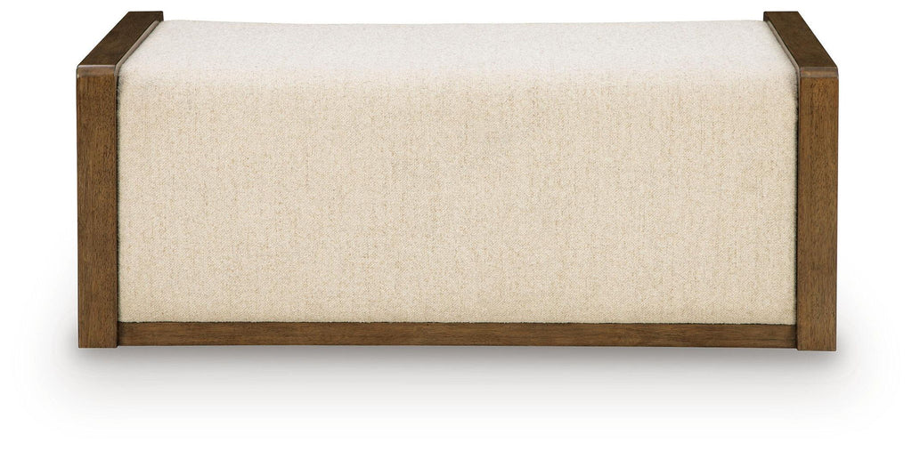 Beige upholstered ottoman with brown wooden frame and clean-lined base