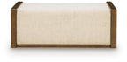 Beige upholstered ottoman with brown wooden frame and clean-lined base
