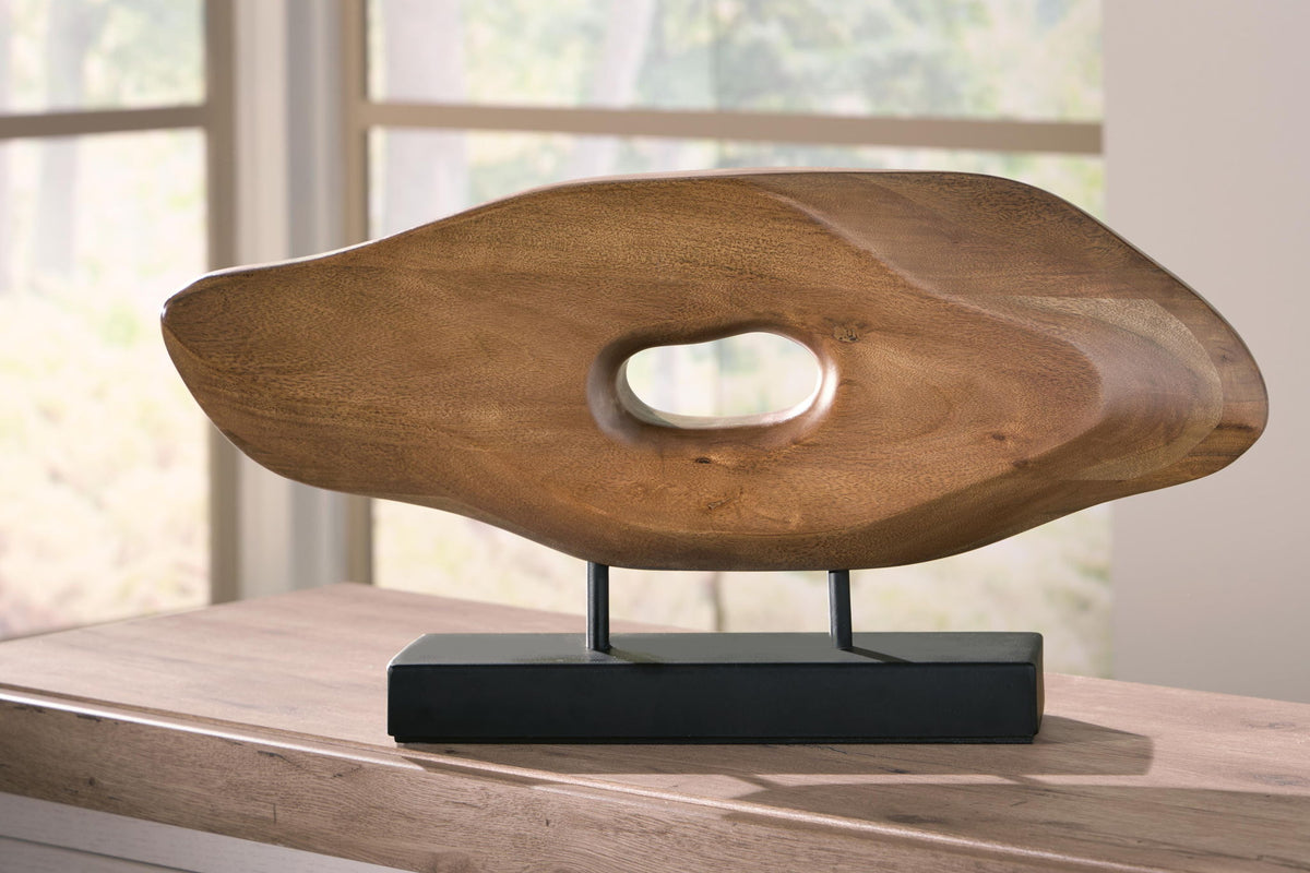 Light brown wood sculpture on black rectangular base with oval center cutout