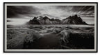 Black-and-white landscape wall art in black frame, mountain and grassland scene