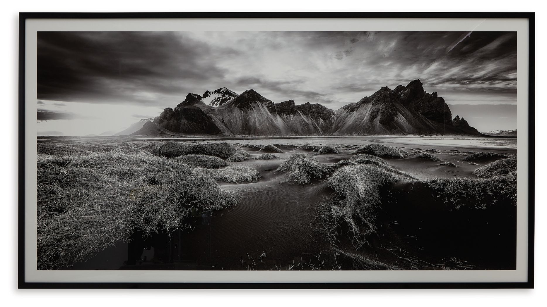 Black-and-white landscape wall art in black frame, mountain and grassland scene