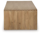 Light brown rectangular table with rounded-edge top and decorative side trim