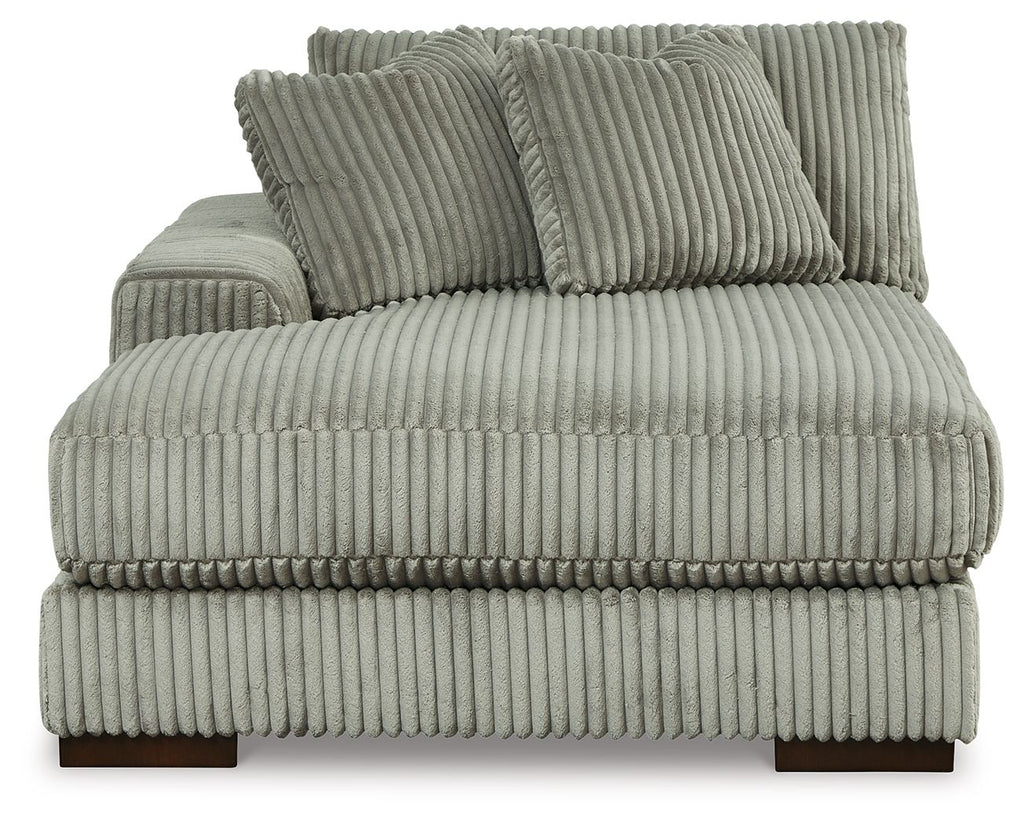 Corner chaise backrest and seat in fog-gray ribbed fabric with two accent pillows
