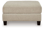 Latte oversized accent ottoman with rounded top and matching upholstered sides