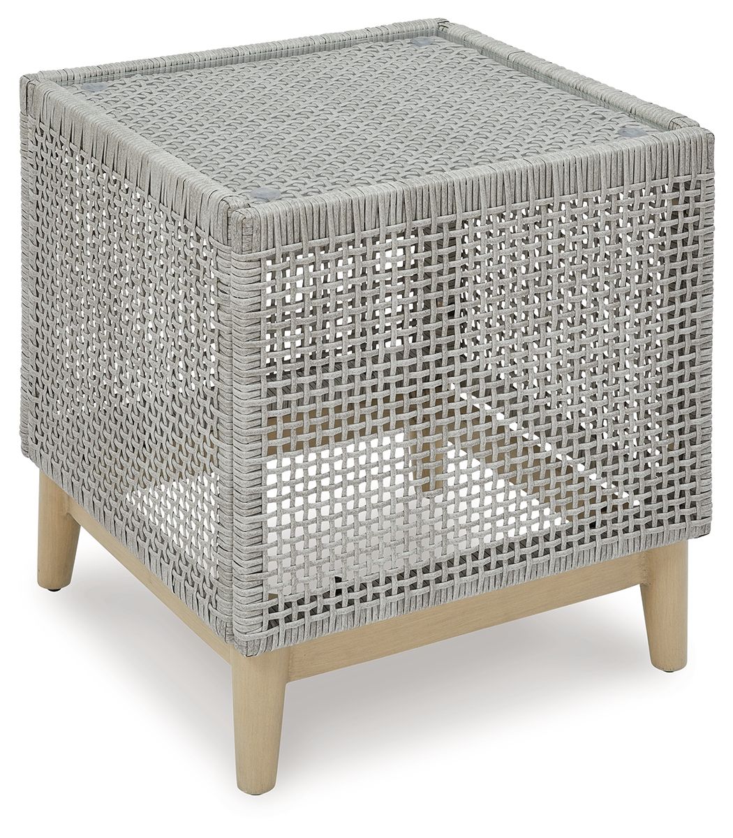 Gray square end table with woven wicker sides and light wood legs