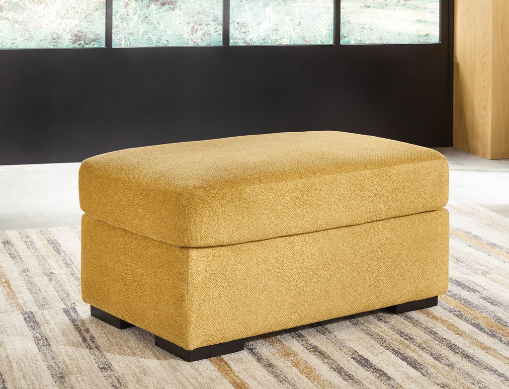 Keerwick ottoman with rounded upholstered seat, sunflower yellow fabric, black base feet