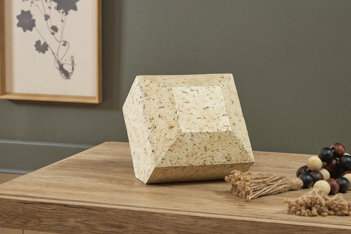 Beige speckled angular sculpture with tapered top, standing display piece