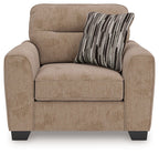 Light brown upholstered chair and a half with seat cushion and striped throw pillow