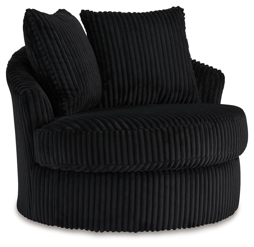 Swivel chair with ribbed dark upholstery, rolled arms, and two back cushions