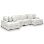 Off-white striped sectional sofa with chaise corner and thick seat cushions.