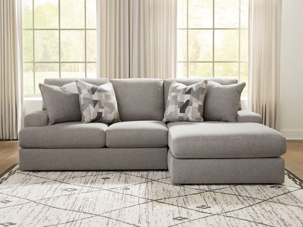 Lindon sectional sofa in smoke gray with chaise ottoman and patterned throw pillows