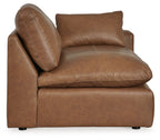 Caramel brown corner chair with deep seat, padded back, and angled arm