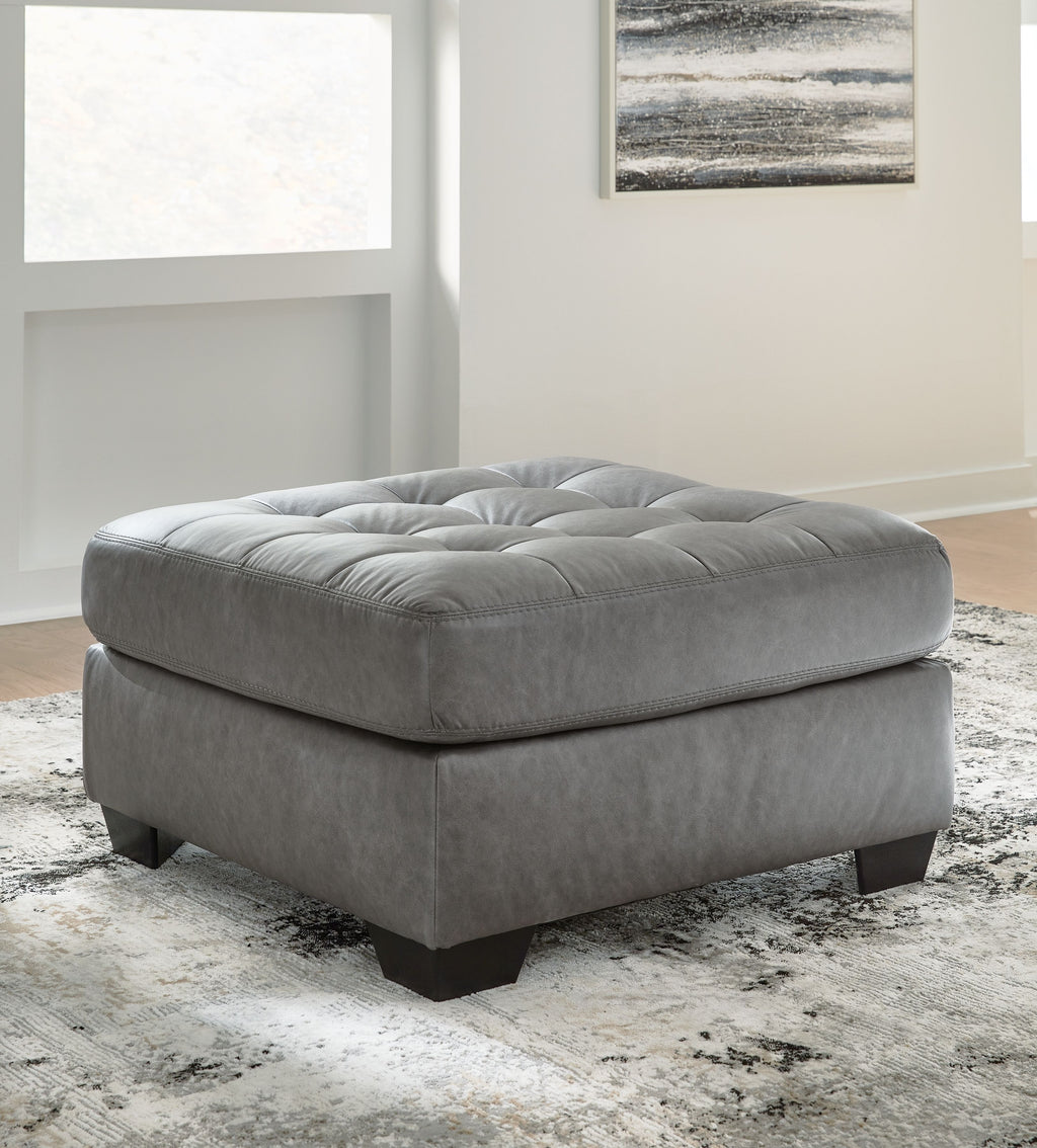 Oversized accent ottoman, gray fabric with tufted seat and low black legs