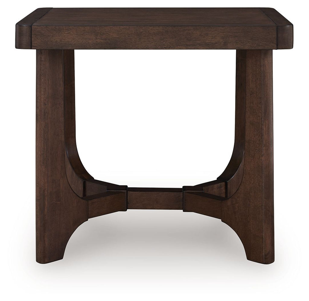 Dark brown rectangular cocktail table with curved apron and centered support rail