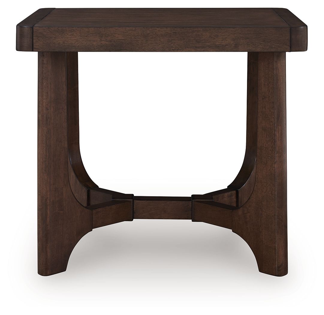Dark brown rectangular cocktail table with curved apron and centered support rail