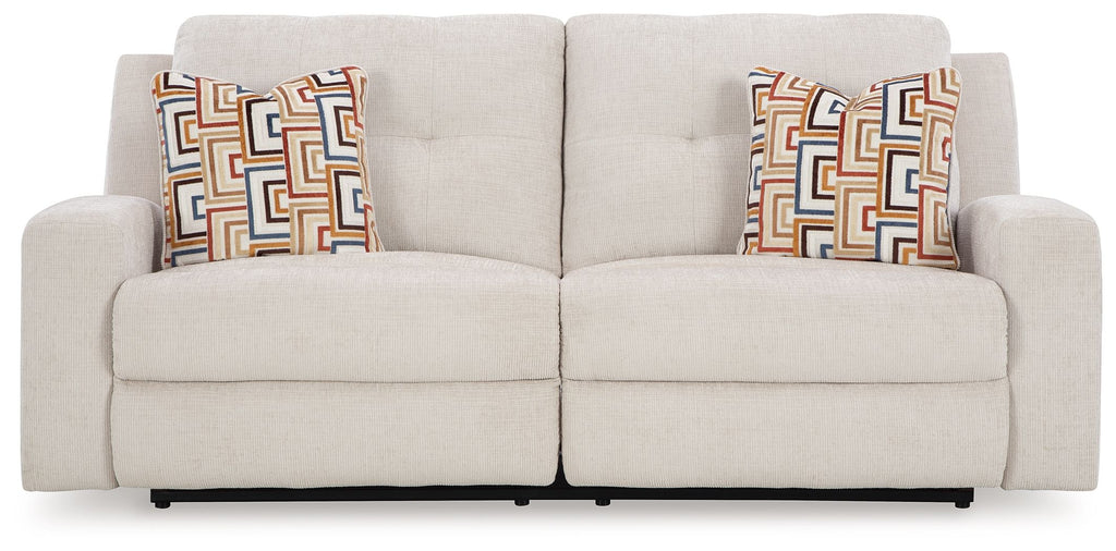 Stone 2-seat reclining sofa with two seat sections and geometric pattern pillows
