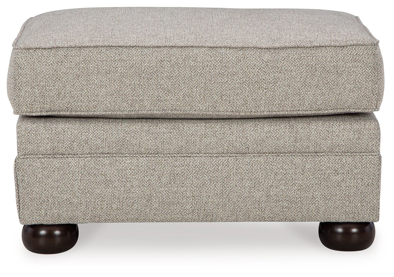Light beige ottoman with padded hinged lid and dark rounded wooden feet
