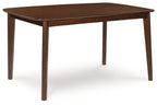 Brown dining table with four slim legs and rounded corners
