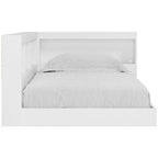 White storage bed with panel headboard and arched interior niche, fitted with gray bedding