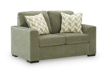 Bridgepoint loveseat in sage green fabric with two chevron-pattern throw pillows