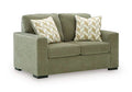 Bridgepoint loveseat in sage green fabric with two chevron-pattern throw pillows
